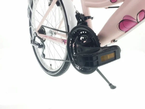 Rosa cykel med blomtryck och pedalstöd