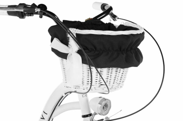 Vit cykelkorg med svart tygöverdrag och rosett.